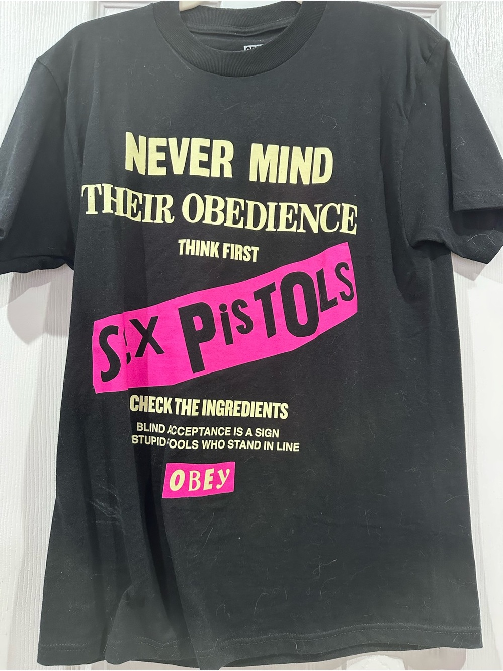 Obey Men’s Never Mind Their Obedience Black Graphic T‑Shirt
